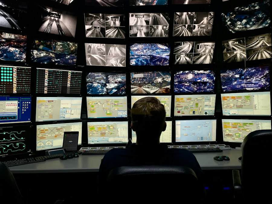 Security technician monitoring a wall of camera feeds